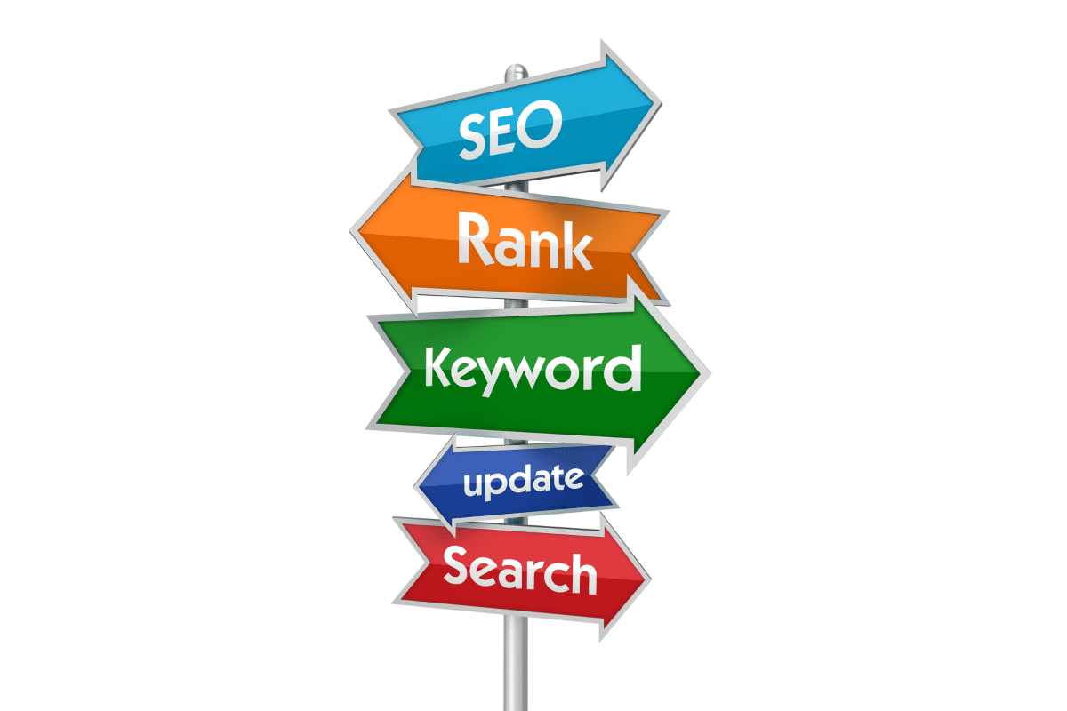 Multi-colored arrows labeled SEO, Rank, Keyword, update & Search on a signpost symbolizing search optimization steps.